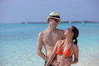 happy young couple have fun on beach