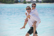 happy young couple have fun on beach