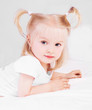 child in bed at home