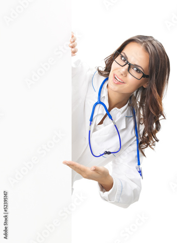 Photo: Doctor showing blank signboard, isolated Doctor showing blank signboard, isolated