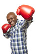 Man wearing boxing gloves smiling