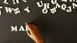 A person spelling Marketing