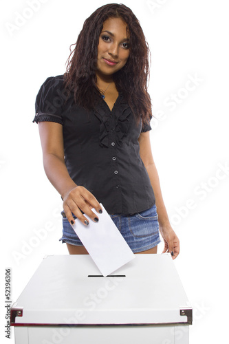 Photo: Latin female voter at the ballot box. Latin female voter at the ballot box.