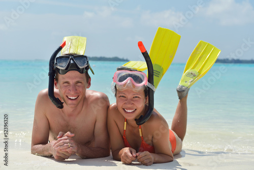 Photo: happy young couple have fun on beach happy young couple have fun on beach
