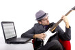 Guitarist looking at tablature online.  