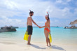 happy young couple have fun on beach