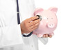 Foto: The doctor with pig bank The doctor with pig bank