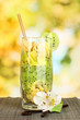 Delicious fruit smoothie on bright background