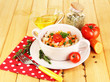 Delicious rice with vegetables and herbs in pot