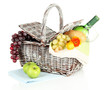Picnic basket with fruits and bottle of wine, isolated on white