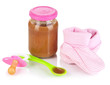 Baby food with baby supplies isolated on white