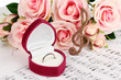 Treble clef, roses and box holding wedding ring