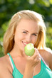 beautiful happy smiling woman with green apple