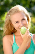 beautiful happy smiling woman with green apple