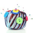 Colorful buttons and multicolor wool ball, isolated on white