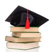 Grad hat with books isolated on white