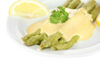 Asparagus with tasty sauce on plate, isolated on white