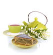 Delicious poppy seed cake with cup of tea isolated on white