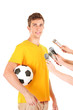 Interview with a young soccer player, isolated on white