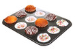 Tasty muffin cakes in baking tray isolated on white