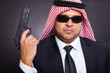 arab hit man holding gun