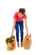 Photo: Young adult woman with heavy shopping bags Young adult woman with heavy shopping bags