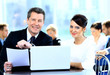Businessmen and businesswoman discussing tasks sitting