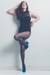 fashion model striking a pose in blue high heels