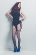 fashion model striking a pose in blue high heels