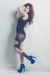 fashion model striking a pose in blue high heels
