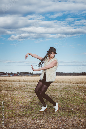 Photo: fashion model posing outdoor in a rural setting fashion model posing outdoor in a rural setting