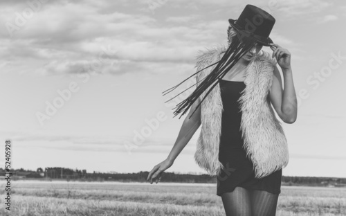 Photo: fashion model posing outdoor in a rural setting fashion model posing outdoor in a rural setting