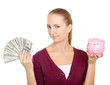 Young beautiful woman with piggy bank