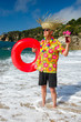 senior man with cocktail drink at the beach