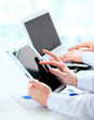 Foto: Image of confident partners working with modern Image of confident partners working with modern