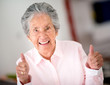 Senior woman with thumbs up