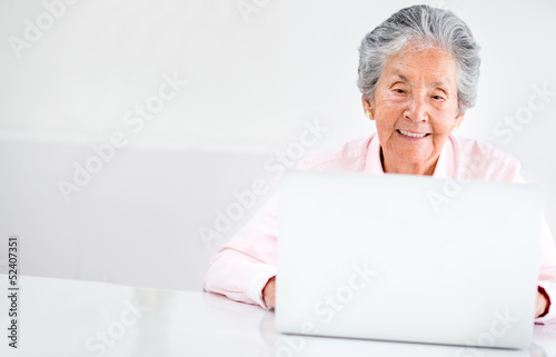 Photo: Old woman using a computer Old woman using a computer
