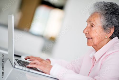 Photo: Elder woman using a computer Elder woman using a computer