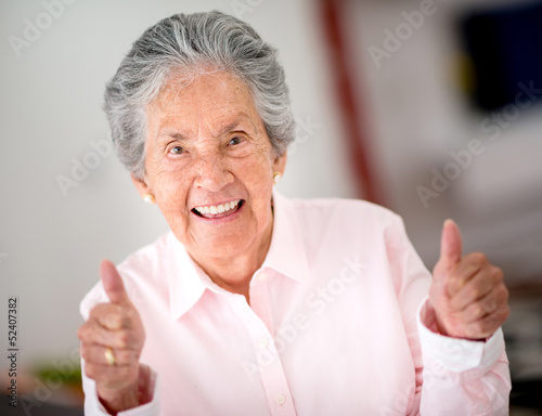 Photo: Senior woman with thumbs up Senior woman with thumbs up