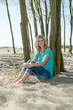 Woman sitting on beach