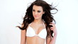 Hot Brunette Woman in White Bikini Bra Posing on White