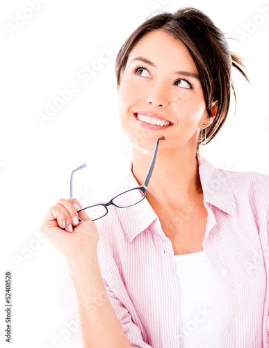 Photo: Thoughtful woman holding glasses Thoughtful woman holding glasses