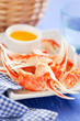 Boiled crab claws with orange sauce, selective focus