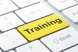 Education concept: Training on computer keyboard background