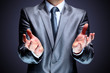 The businessman, a gesture, a finger.