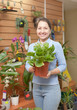 Happy  woman in floral store