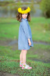portrait of little girl outdoors with narcissus