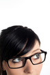 Cropped image a young woman's face with her eyes looking at corn