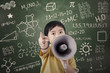 Photo: Boy with speaker at classroom Boy with speaker at classroom