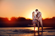 couple on the beach in the evening